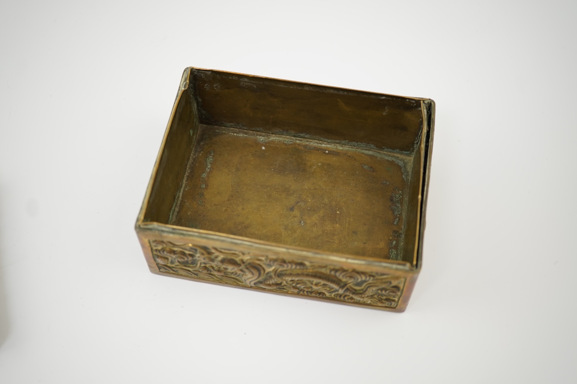 A Chinese brass 'dragon' box, inset with a 17th/18th century jade plaque